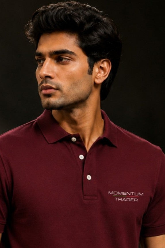 Man wearing a maroon polo shirt with 'Momentum Trader' logo on a dark background