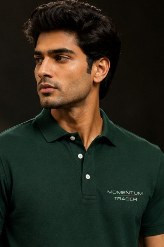 Man wearing a green polo shirt with 'Momentum Trader' logo on a dark background