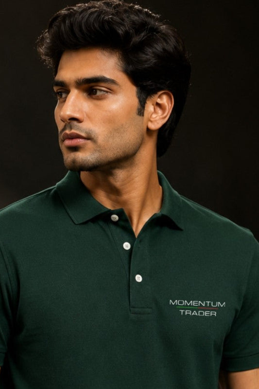 Man wearing a green polo shirt with 'Momentum Trader' logo on a dark background
