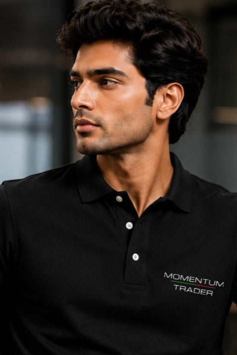 Man wearing a black polo shirt with 'Momentum Trader' logo