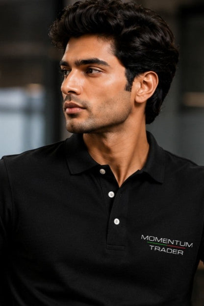 Man wearing a black polo shirt with 'Momentum Trader' logo