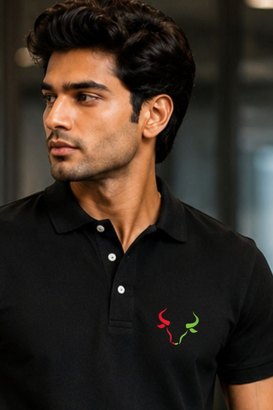 Man wearing a black polo shirt with a logo on a blurred background