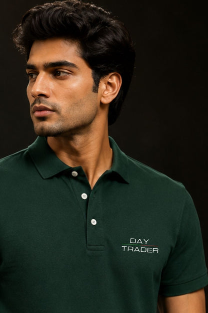 Man wearing a dark green polo shirt with 'DAY TRADER' text on a black background