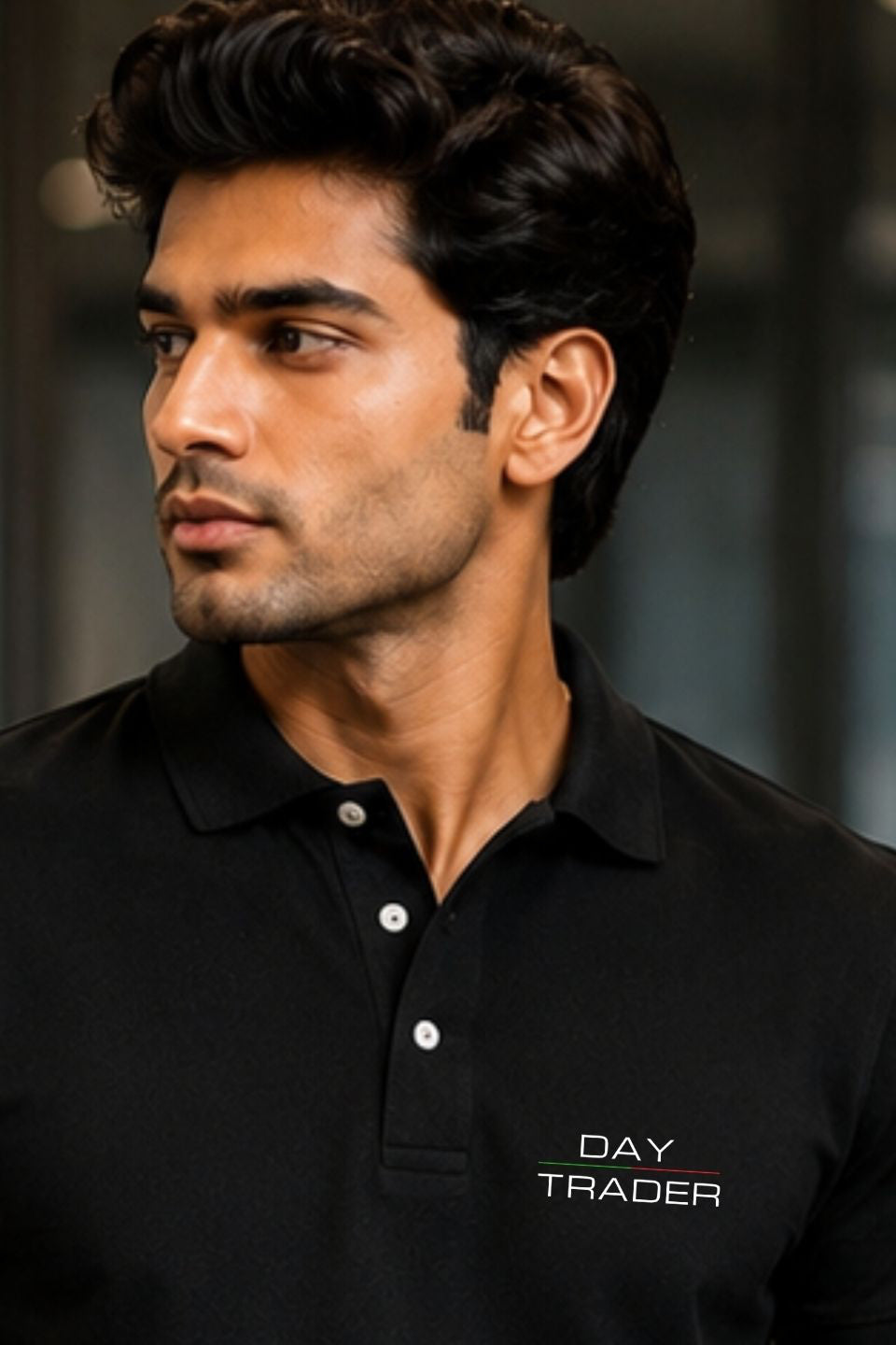 Man wearing a black polo shirt with 'Day Trader' text on a blurred background
