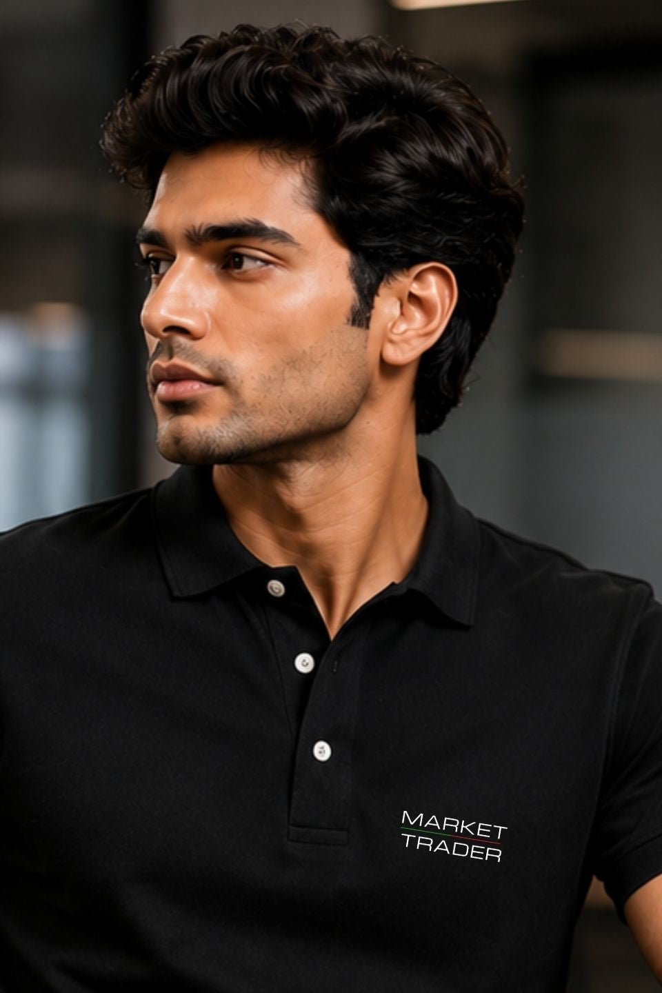 Man wearing a black polo shirt with 'Market Trader' logo