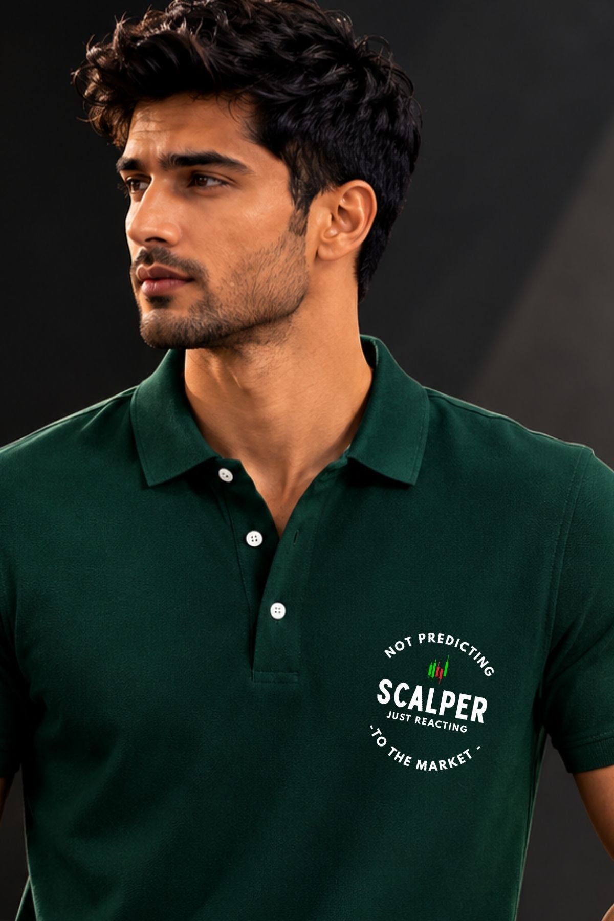 Man wearing a green polo shirt with a printed design on a dark background